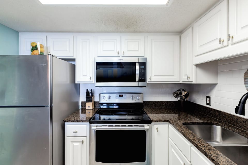 KITCHEN WITH DISHWASHER, MICROWAVE, TOASTER, KEURIG, COFFEEMAKER, CROCKPOT