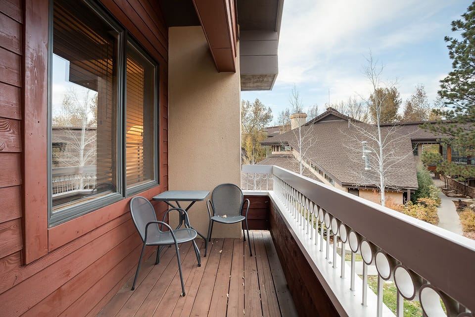 Step onto your private balcony and breathe in the fresh mountain air while enjoying peaceful neighborhood views from your cozy outdoor retreat.