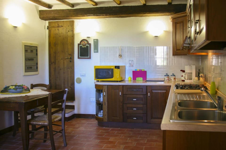 Furniture, Interior Design, Countertop, Wood, Kitchen, Kitchen Appliance, Flooring, Ceiling, Room, Cabinetry
