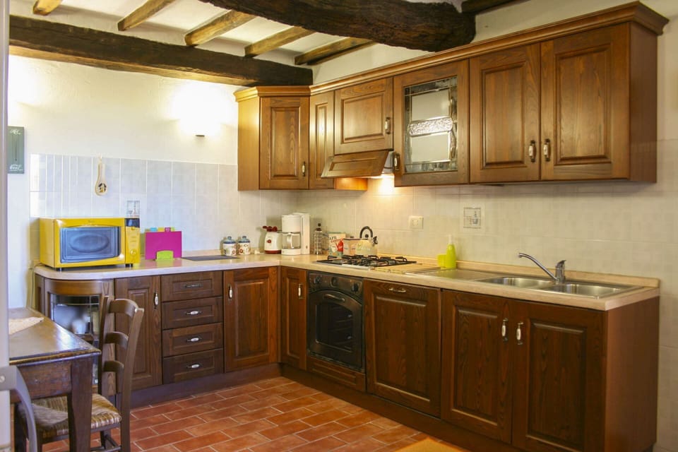 Kitchen, Kitchen Appliance, Countertop, Furniture, Cabinetry, Major Appliance, Interior Design, Wood, Flooring, Ceiling