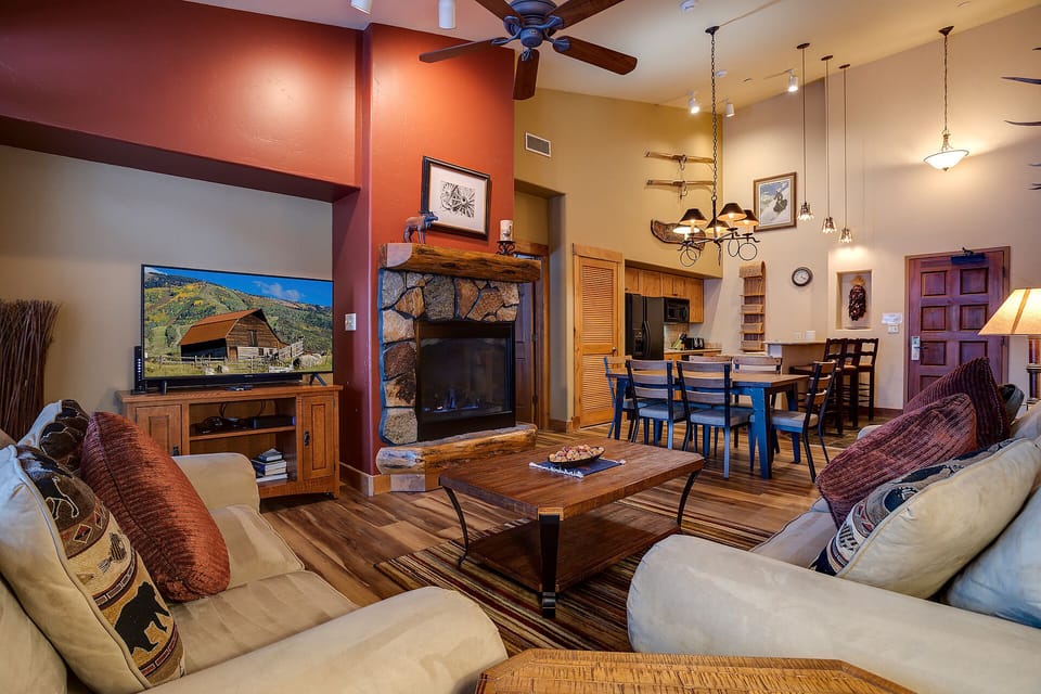 Sink into plush sofas beside the crackling fireplace while your favorite shows play on the big screen TV.