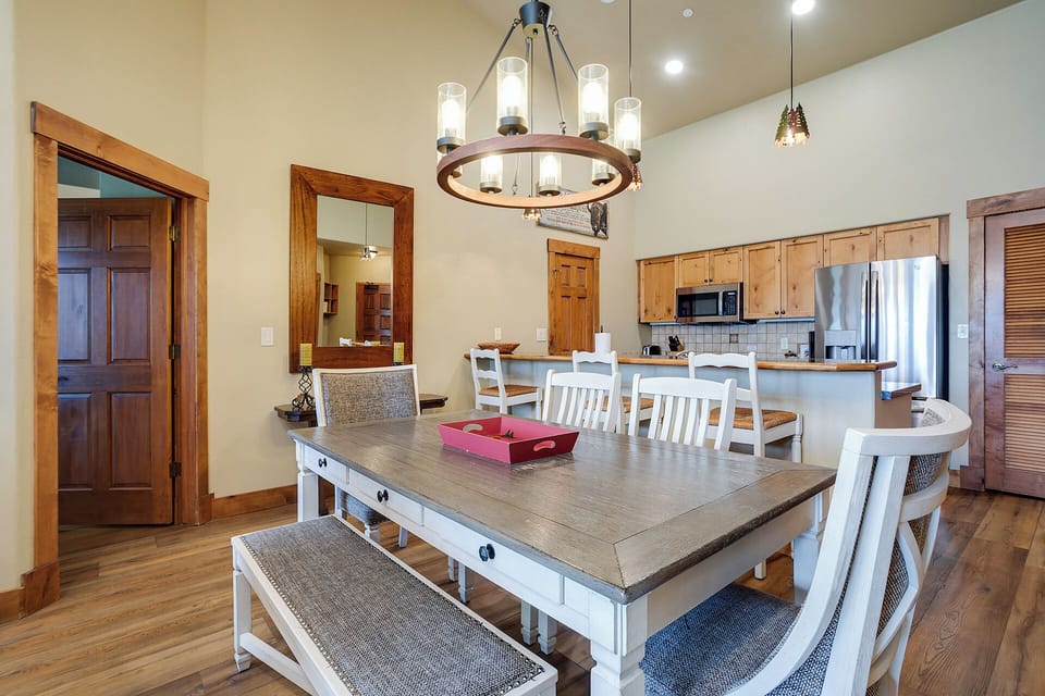 Gather around your spacious dining table where rustic charm meets modern comfort, perfect for memorable meals together.