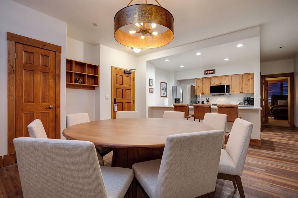 Gather around your spacious dining table for memorable meals while the stunning chandelier casts warm light over intimate conversations.