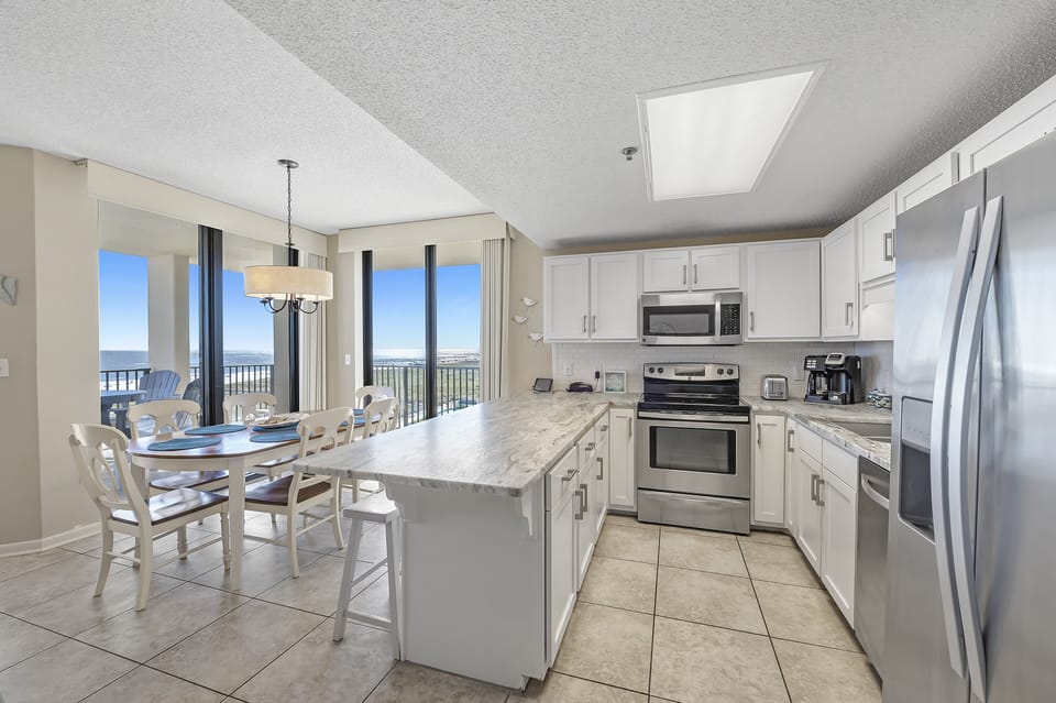 Full Kitchen with Granite Countertops, Stainless Steel Appliances and additional Seating at the Breakfast Bar