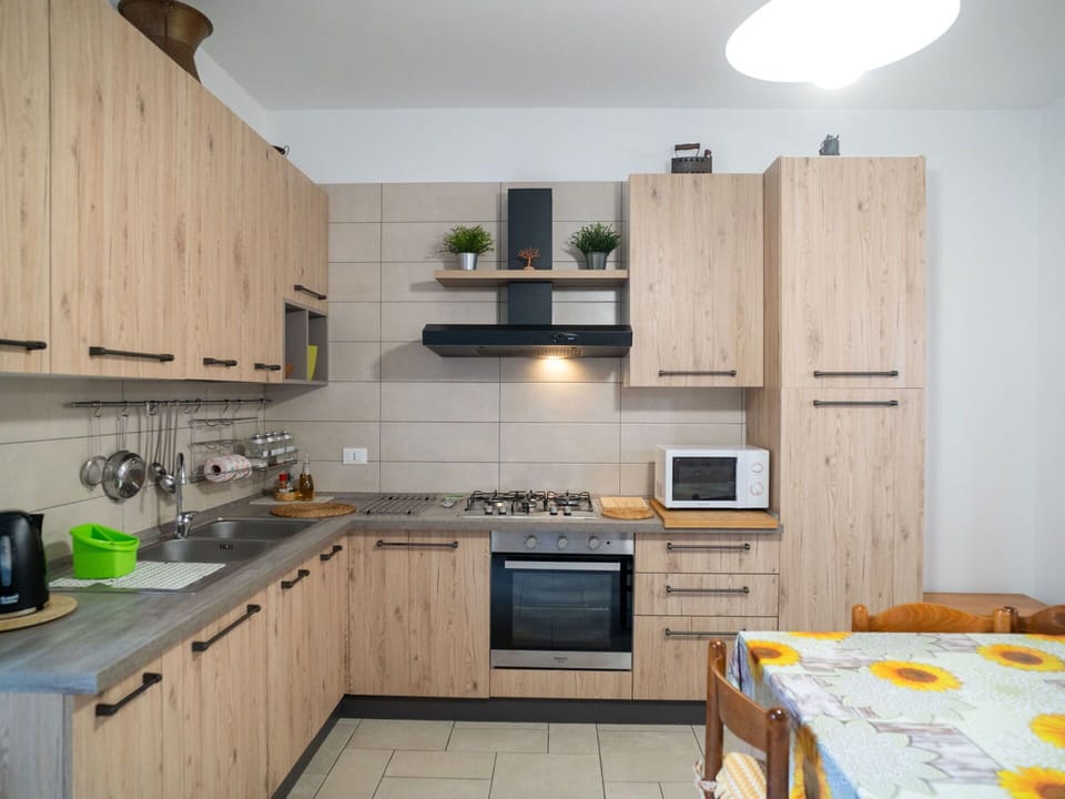 Kitchen, Kitchen Appliance, Furniture, Wood, Countertop, Major Appliance, Interior Design, Cabinetry, Home Appliance, Kitchen Stove