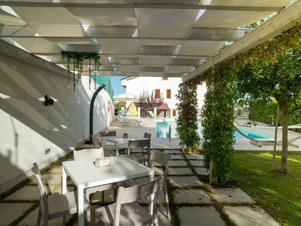 Swimming Pool, Outdoor Furniture, Furniture, Chair, Shade, Composite Material, Resort, Outdoor Table, Eco Hotel, Courtyard