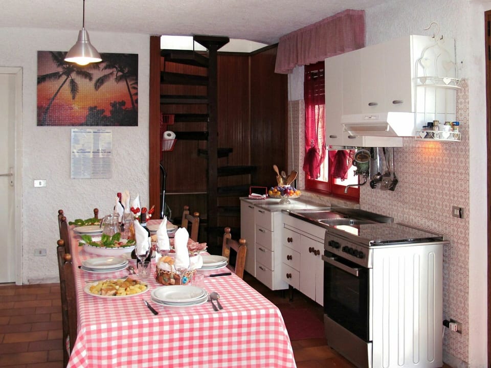 Cabinetry, Furniture, Property, Countertop, Table, Chair, Lighting, Tableware, Interior Design, Kitchen