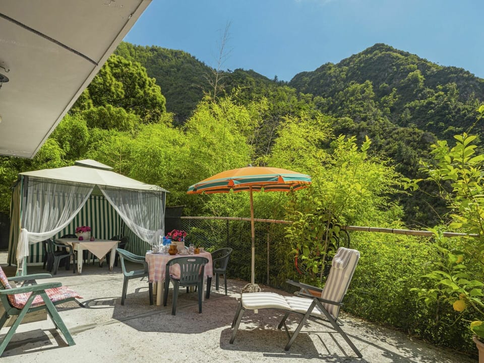 Plant, Sky, Table, Shade, Umbrella, Tent, Mountain, Outdoor Furniture, Tree, Outdoor Table