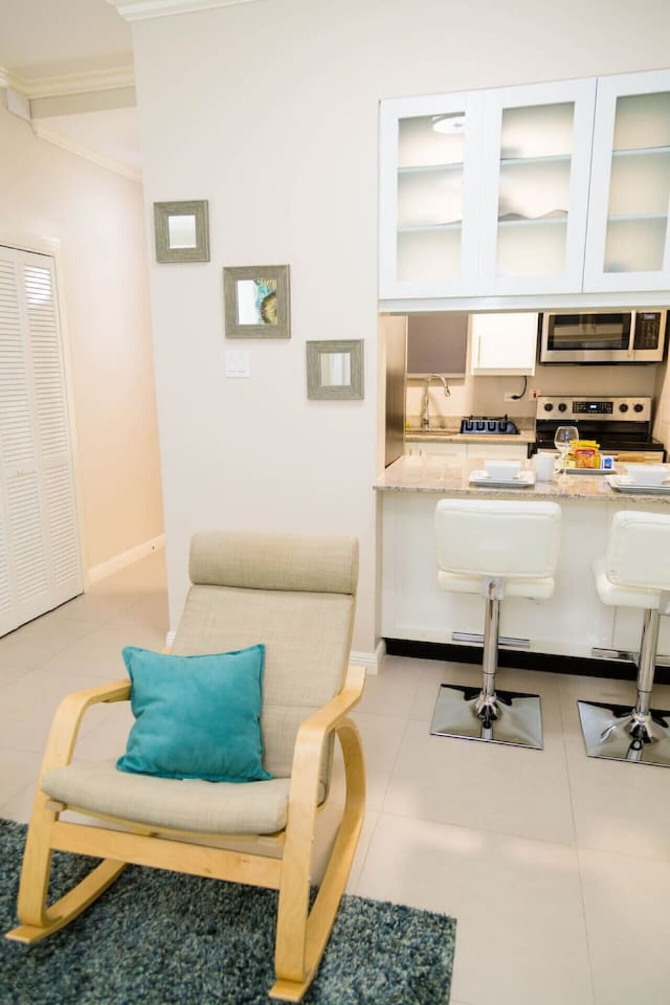 Pull up a stool at the breakfast bar for casual dining beside the compact kitchen.