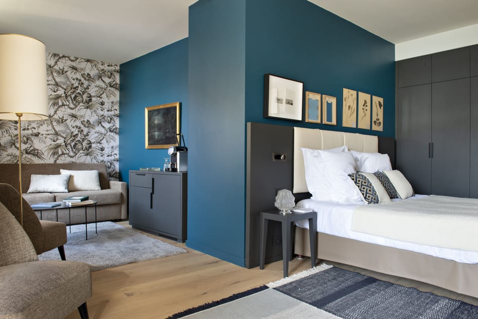 Double Room, Balcony, Partial Lake View | Free minibar items, in-room safe, desk, blackout drapes