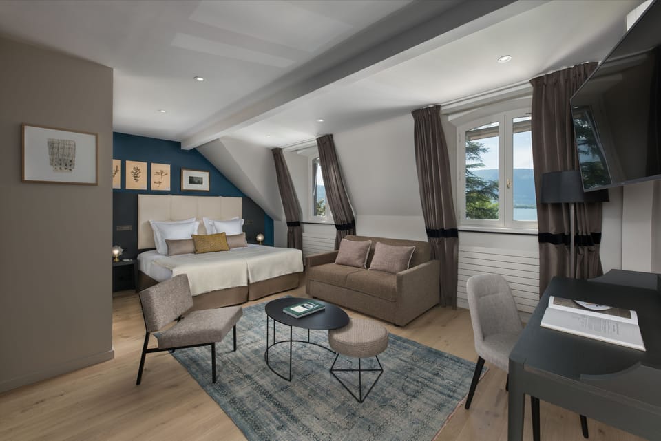 Double Room, Balcony, Partial Lake View | Free minibar items, in-room safe, desk, blackout drapes