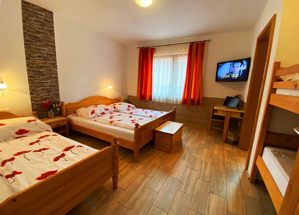Classic Quadruple Room, 1 Bedroom | 1 bedroom, pillowtop beds, desk, free wired internet