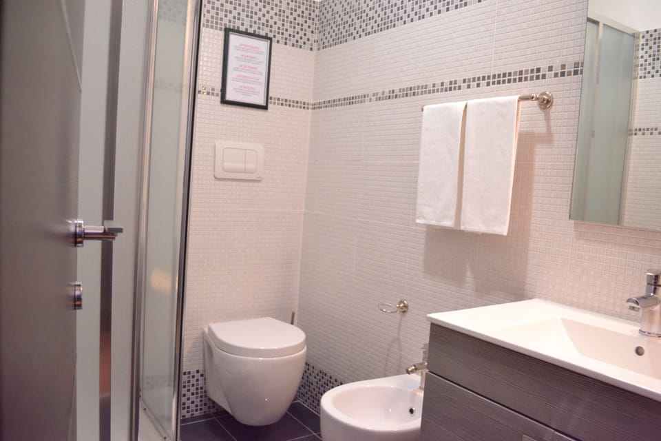 Shower, rainfall showerhead, hair dryer, towels