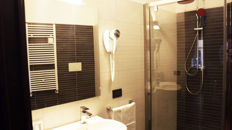 Shower, rainfall showerhead, hair dryer, towels