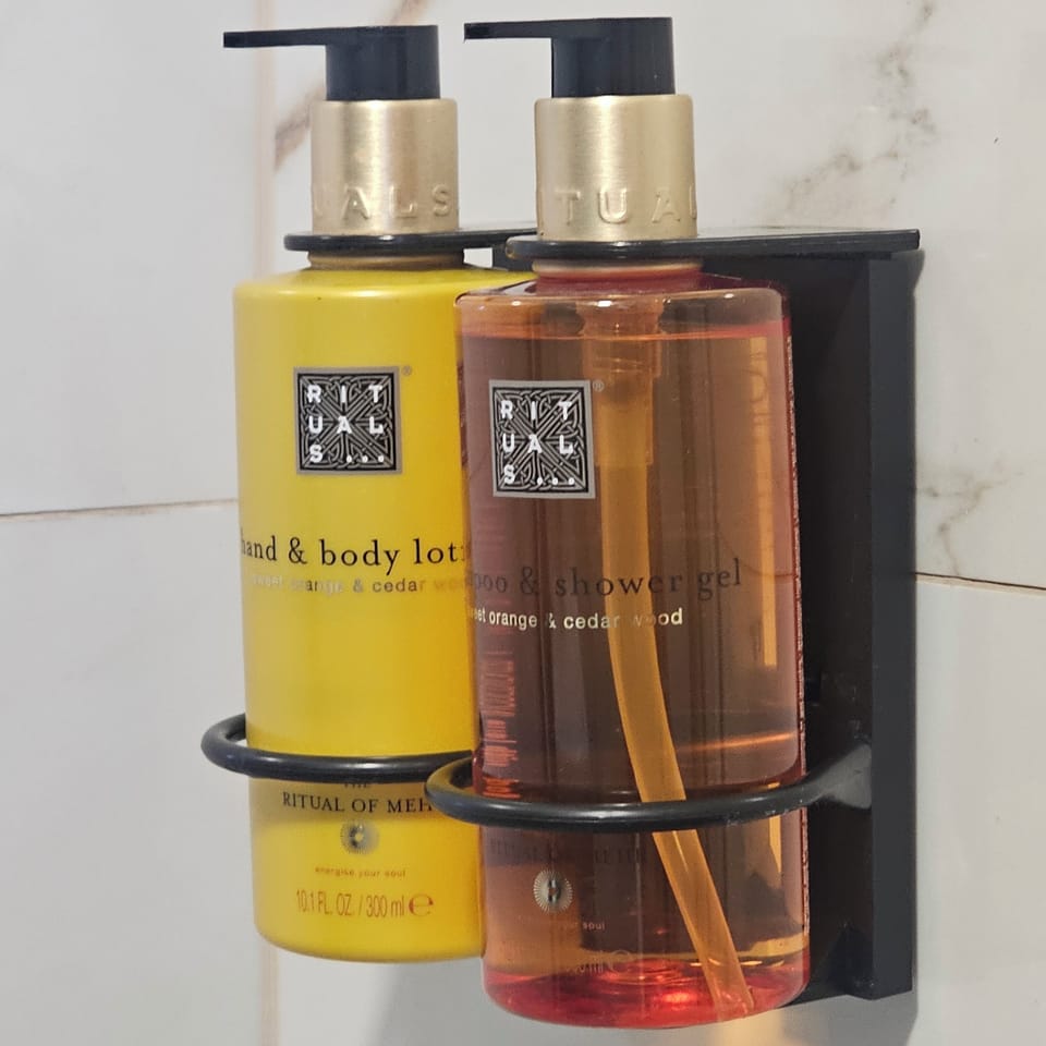 Rainfall showerhead, designer toiletries, hair dryer, slippers