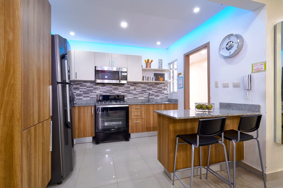 Fully Furnished Kitchen with a two chair island.