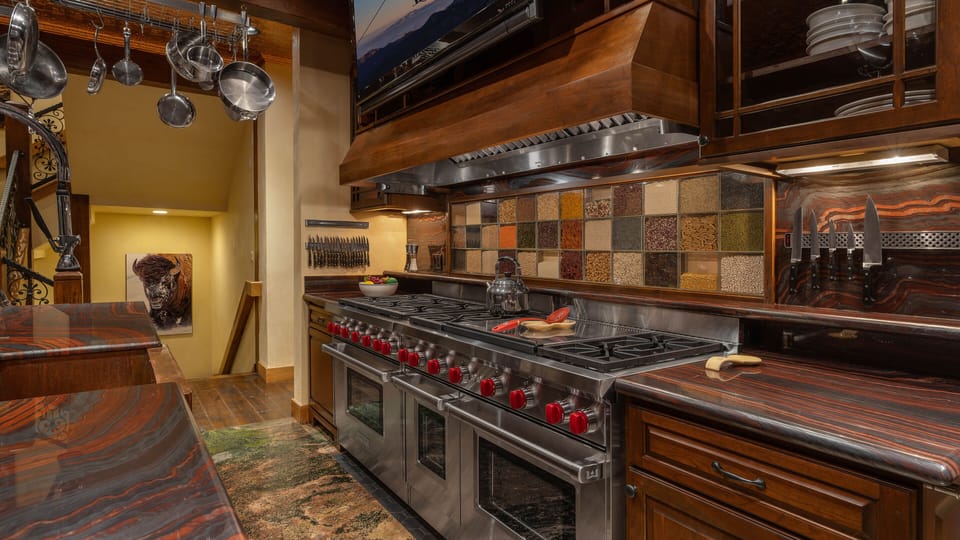 Kitchen, Main Level - Wolf range with 3 ovens and 10 burners.