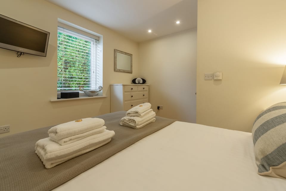 6 Sandy Lane, Carbis Bay. First floor: Bedroom two has a wall mounted Smart television