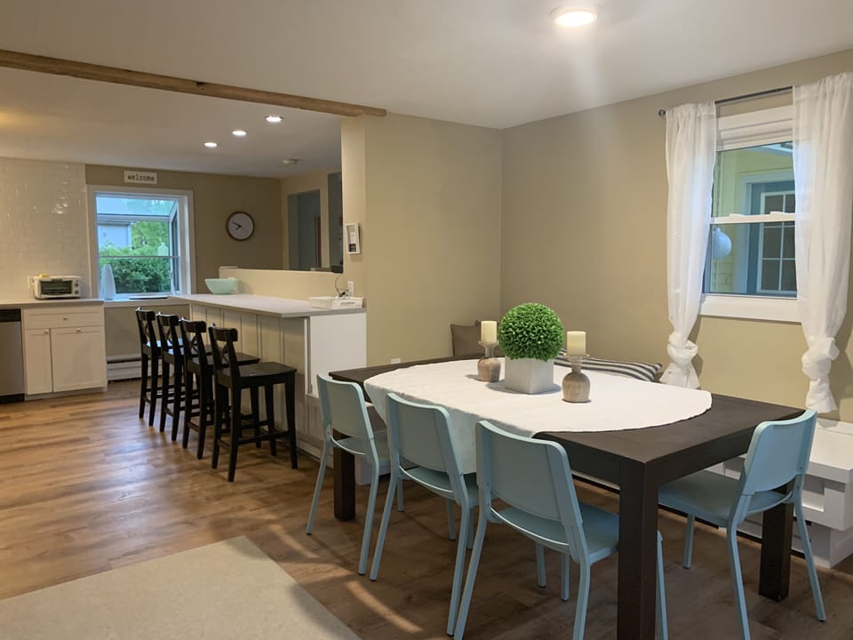 Diner table and custom bench that fits 8-10 people 
plus 4 seats at the counter