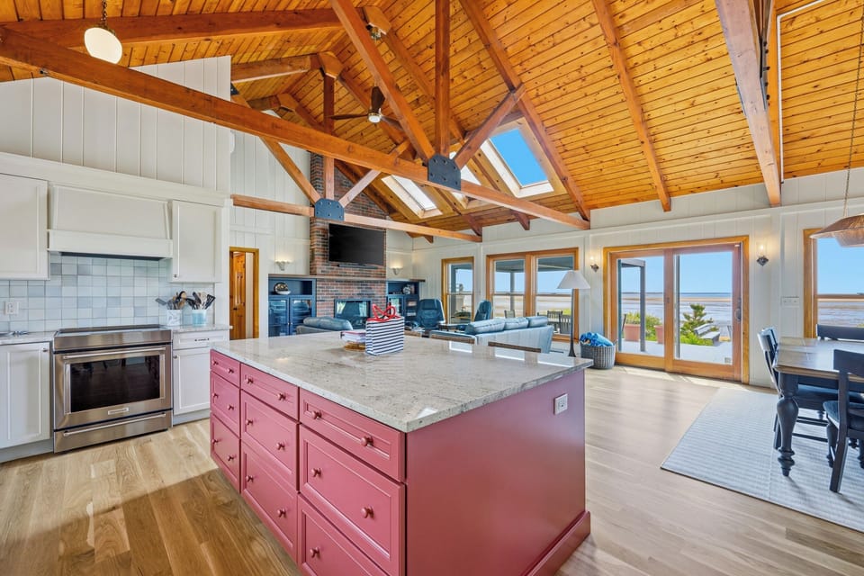 Kitchen with Dining and Living Space in Background