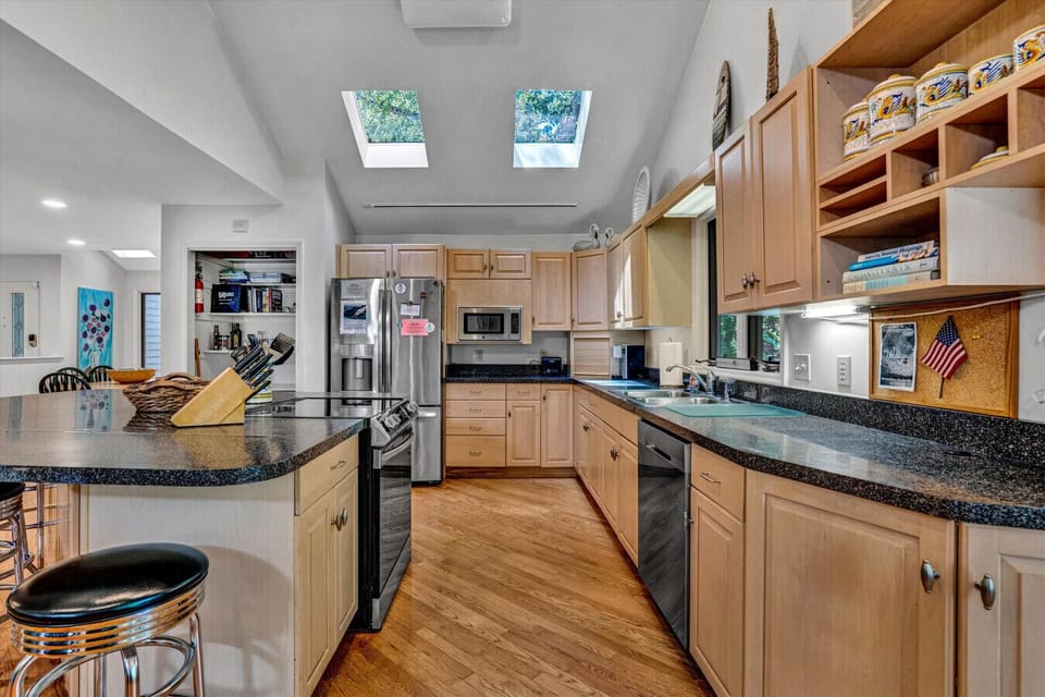 Sleek kitchen design with all the utensils you need for home-cooked meals.