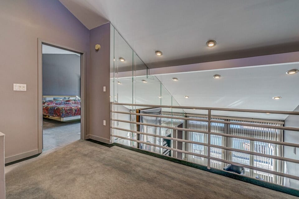 Reflections loft off the master bedroom looking  down to the living area below