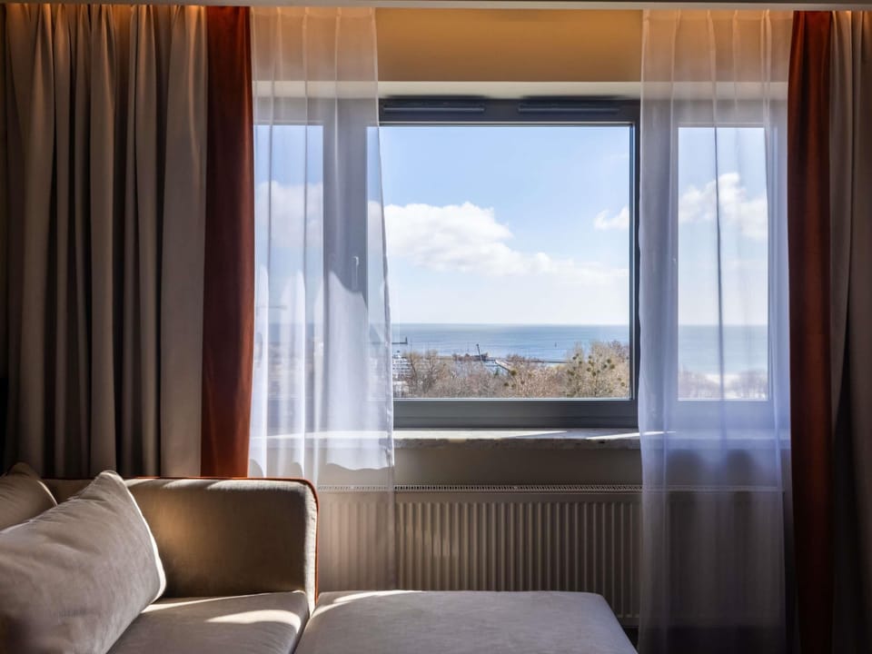 Executive Suite, 1 Queen Bed, Sea View | Minibar, in-room safe, desk, iron/ironing board