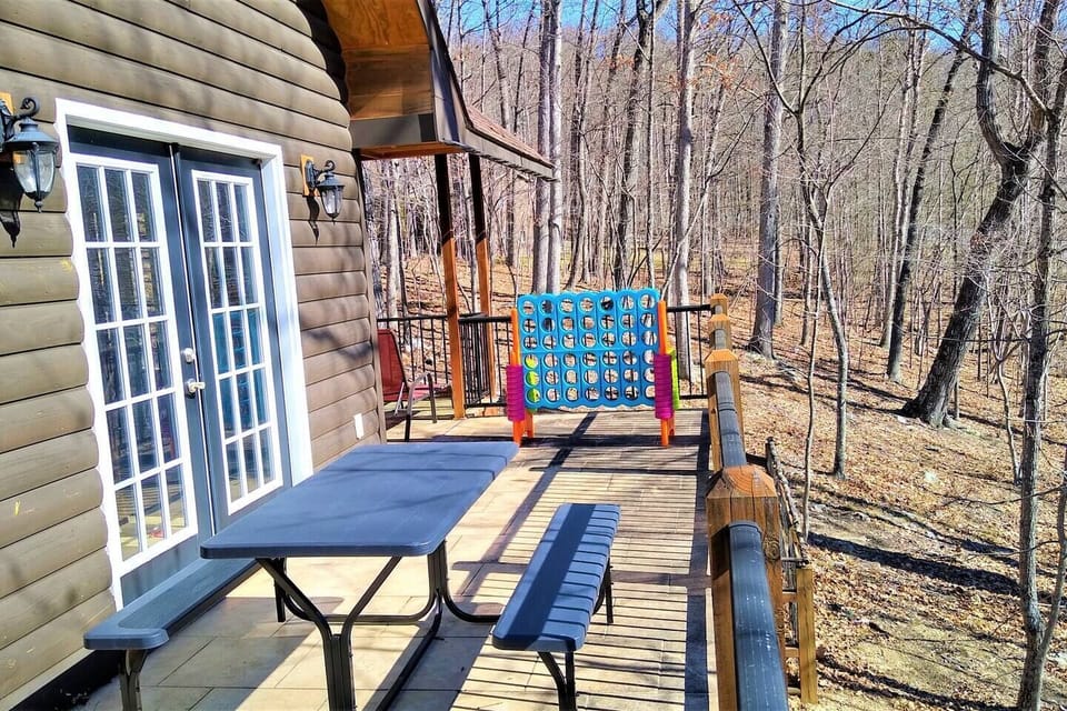 Wrap around balcony with picnic table, huge Connect-4 game and gas bbq grill.