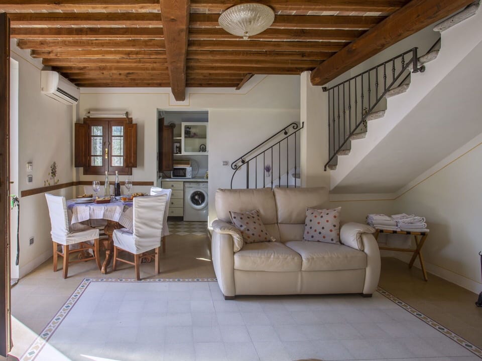 Furniture, Property, Ceiling Fan, Cabinetry, Table, Couch, Lighting, Picture Frame, Wood, Countertop