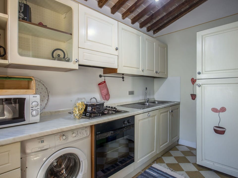 Furniture, Property, Ceiling Fan, Cabinetry, Table, Couch, Lighting, Picture Frame, Wood, Countertop
