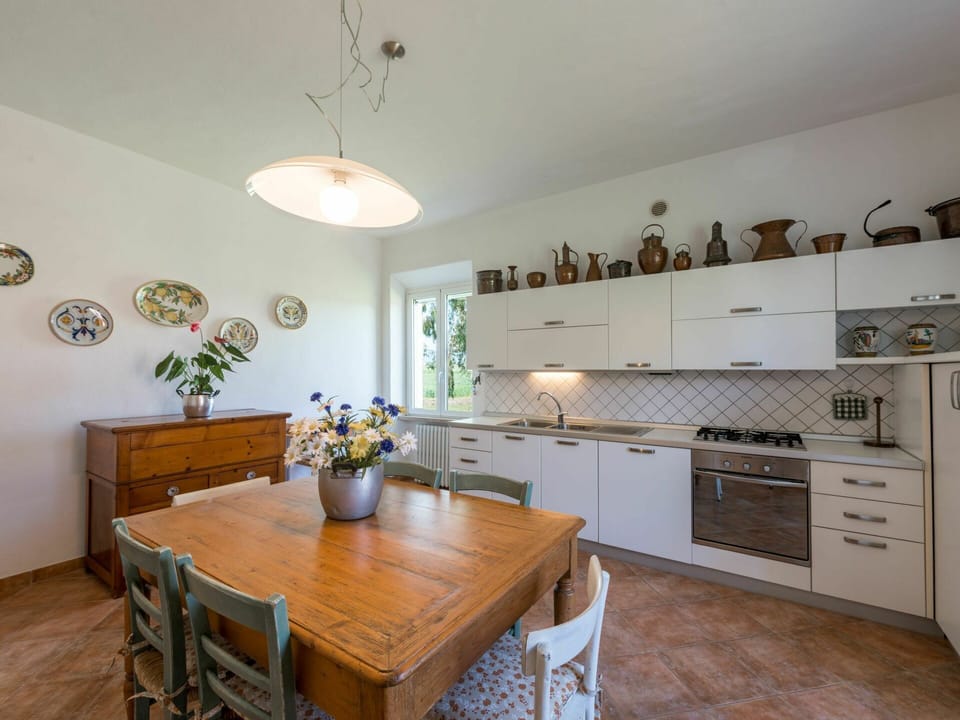 Table, Furniture, Cabinetry, Wood, Chair, Countertop, Interior Design, Plant, Drawer, Kitchen Stove