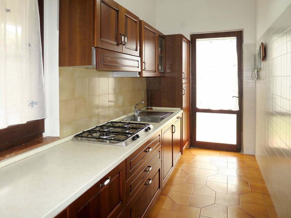 Countertop, Property, Room, Kitchen, Cabinetry, Furniture, Floor, Sink, Building, Interior Design