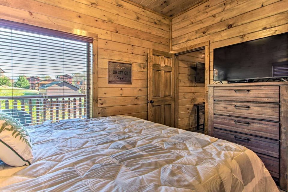 Another view of bedroom with with a large window and 43" smartv