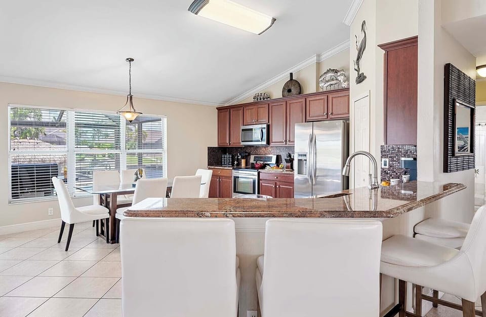 Kitchen is Open to Living Area and Offers Seating on the Bar Counter