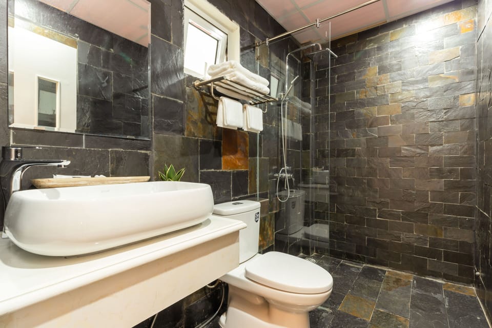 Shower, free toiletries, hair dryer, slippers