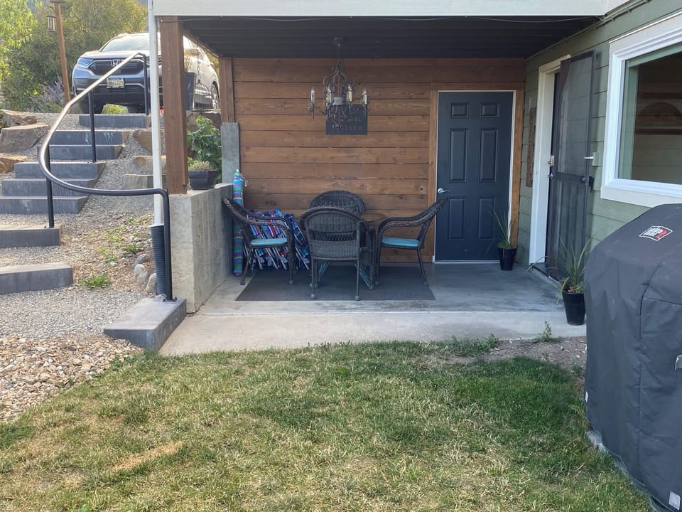 Parking stall above left with covered entrance and patio space