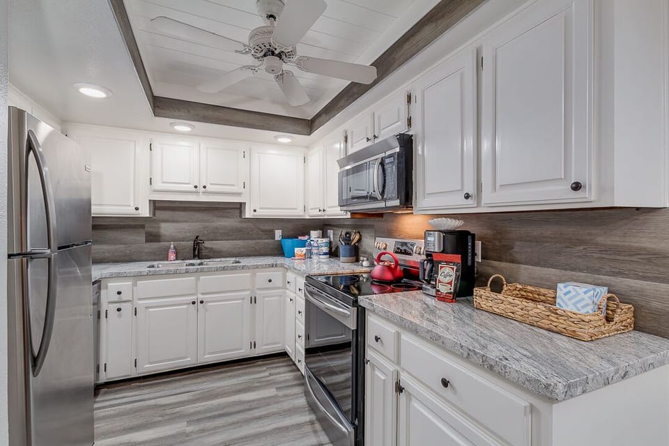 Gorgeous upgraded kitchen with luxurious touches. Notice the ceiling and backsplash!