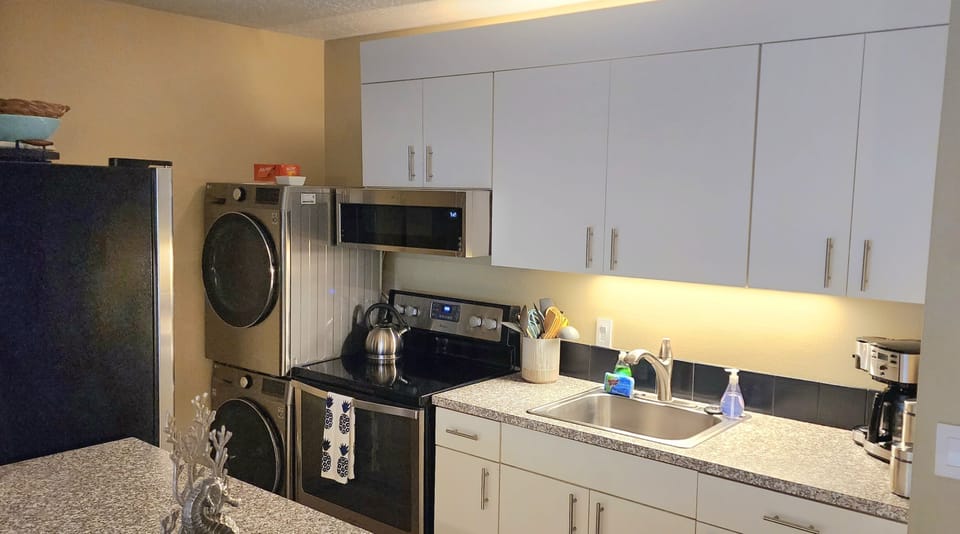 Well equipped kitchen with in unit washer and dryer. 