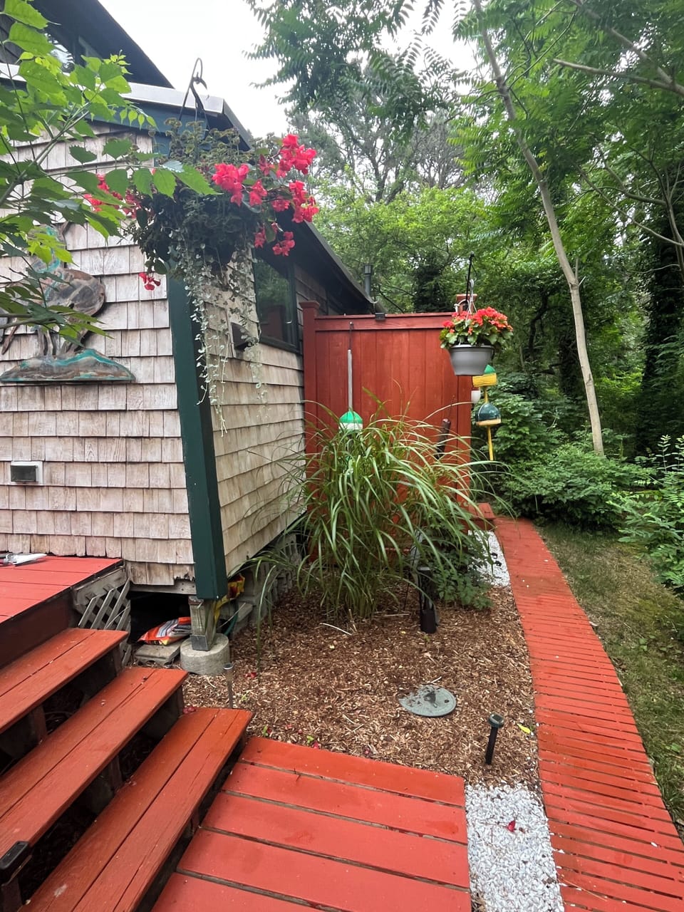 private shower on side of house with full changing area 