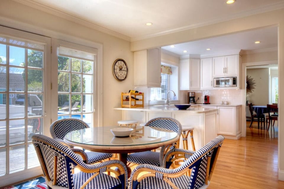 Eat-in-kitchen area with doors leading out to the veranda and deck.