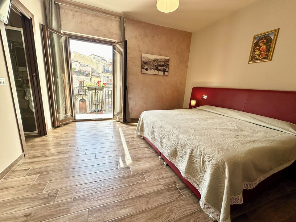 Deluxe Triple Room, Balcony | Memory foam beds, desk, laptop workspace, soundproofing
