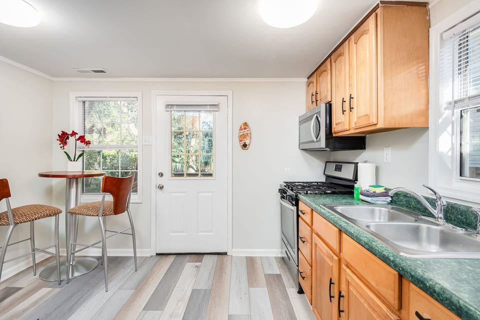 The kitchen has direct assess to the back yard, and grill spot.
