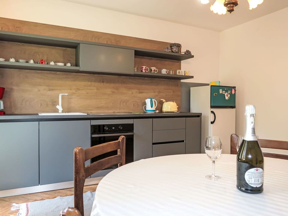 Furniture, Kitchen, Countertop, Interior Design, Cabinetry, Flooring, Wood, Kitchen Appliance, Room, Floor
