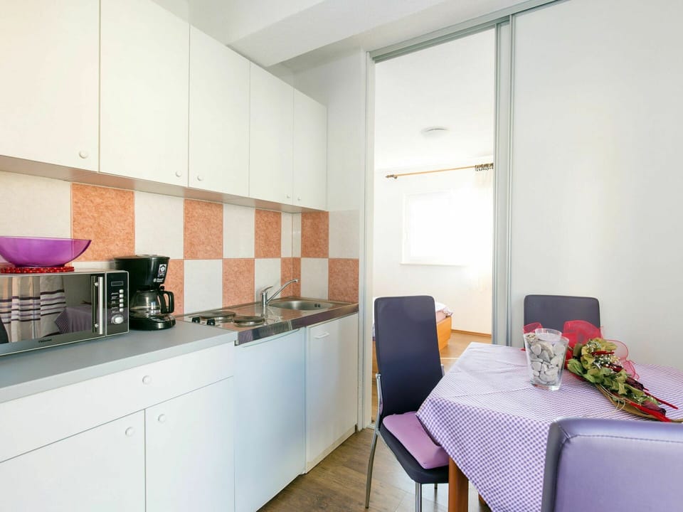 Furniture, Building, Cabinetry, Table, Countertop, Chair, Kitchen Appliance, Interior Design, House, Kitchen Stove