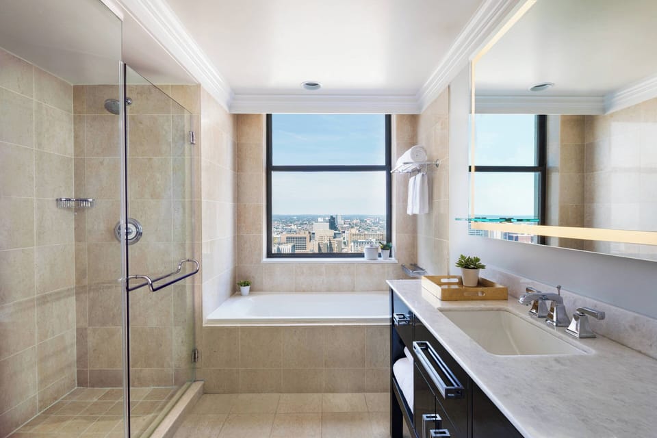 Luxury Suite, 1 Bedroom | Bathroom | Separate tub and shower, designer toiletries, hair dryer, bathrobes