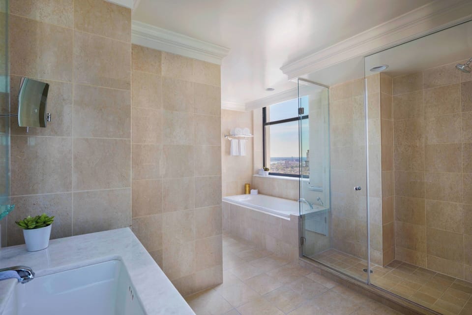 Separate tub and shower, designer toiletries, hair dryer, bathrobes