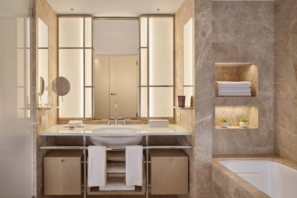 Separate tub and shower, rainfall showerhead, free toiletries