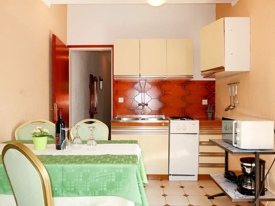 Room, Furniture, Property, Orange, Interior Design, Green, Kitchen, Building, Cabinetry, Yellow
