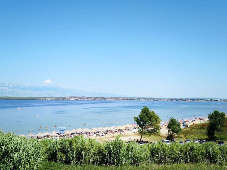 Water, Sky, Cloud, Water Resources, Azure, Tree, Natural Landscape, Beach, Coastal And Oceanic Landforms, Plant