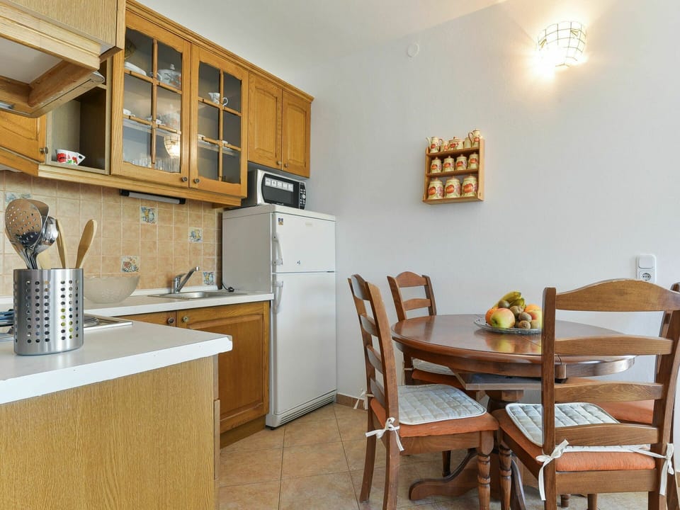 Cabinetry, Furniture, Property, Table, Countertop, Kitchen Appliance, Interior Design, Chair, Wood, Lighting